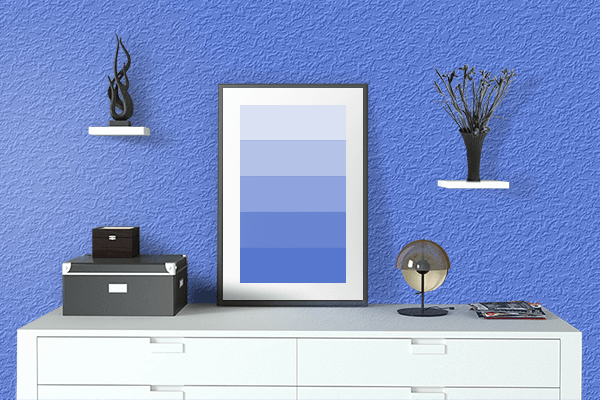 Pretty Photo frame on Shiny Blue color drawing room interior textured wall