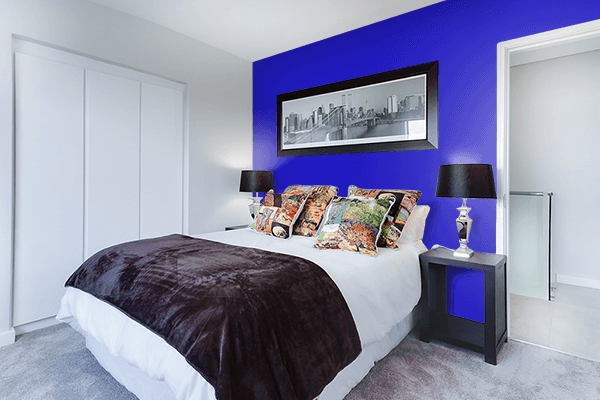 Pretty Photo frame on International Klein Blue color Bedroom interior wall color