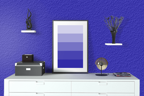 Pretty Photo frame on International Klein Blue color drawing room interior textured wall