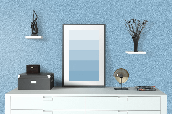Pretty Photo frame on Soft Blue color drawing room interior textured wall
