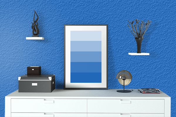 Pretty Photo frame on Blue Grotto color drawing room interior textured wall