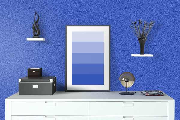 Pretty Photo frame on Brilliant Blue color drawing room interior textured wall