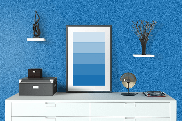 Pretty Photo frame on Dell Blue color drawing room interior textured wall