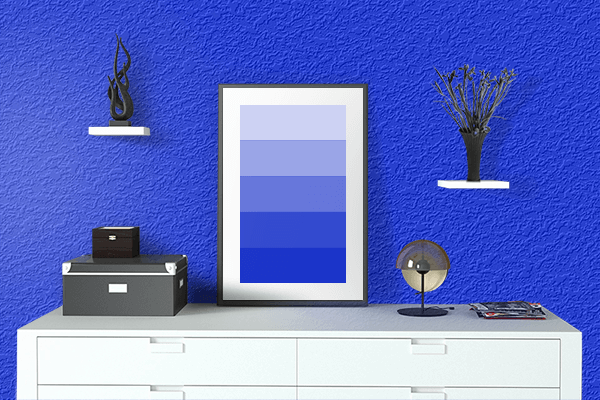Pretty Photo frame on Vibrant Blue color drawing room interior textured wall