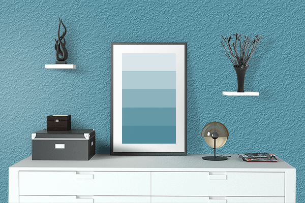 Pretty Photo frame on Caribbean Blue color drawing room interior textured wall
