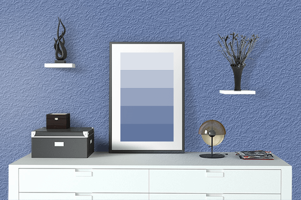 Pretty Photo frame on Mild Blue color drawing room interior textured wall