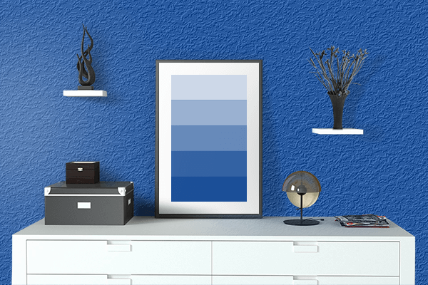 Pretty Photo frame on Cobalt Blue color drawing room interior textured wall