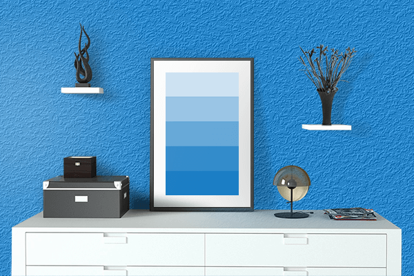 Pretty Photo frame on Blue Cola color drawing room interior textured wall