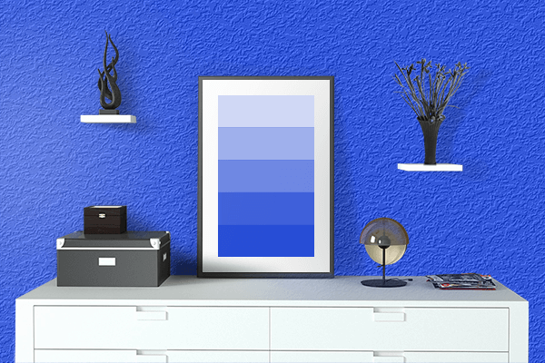 Pretty Photo frame on Blue (RYB) color drawing room interior textured wall