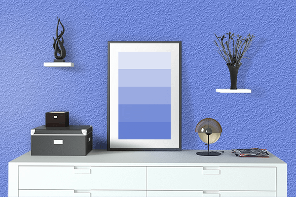 Pretty Photo frame on Cornflower Blue color drawing room interior textured wall