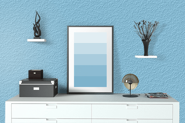 Pretty Photo frame on Baby Blue color drawing room interior textured wall