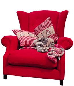 Bright red colored winged chair with cushions