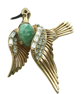 Brooch of bird with large emerald