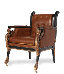 Carved wooden chair with brown upholstery