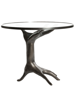 Coffee table with a sculptute of hand