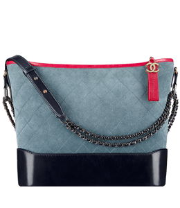 Dull blue suede handbag with red and black lining