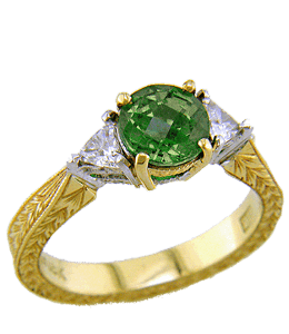 Gold wedding ring with deep emerald