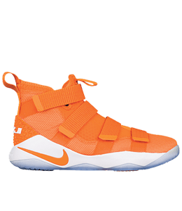 Orange track spike shoes