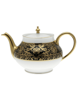 Porcelain tea pot with black and gold ornate design