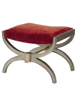 Red colored velvet upholstery on a stool