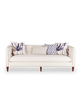 Three seater sofa with white upholstery and printed cushion
