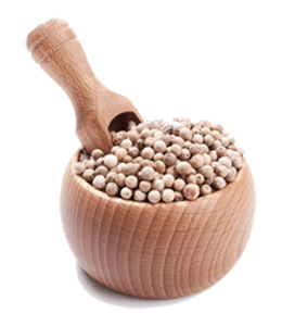 White pepper in wooden bowl with spoon